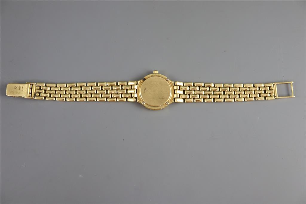 A ladys 18ct. gold Omega quartz wrist watch with diamond set bezel and numerals,